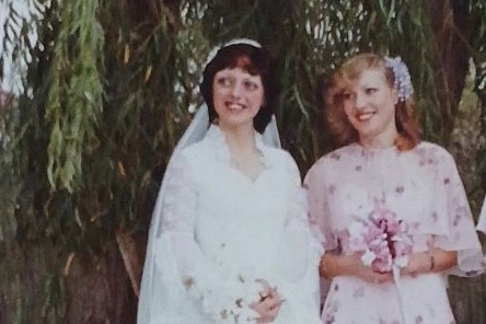 Kelly on her wedding day with bridesmaid